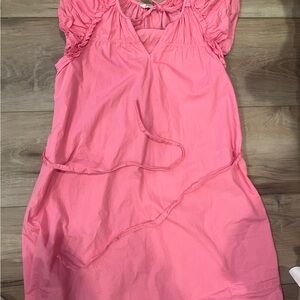 Bubble gum pink, thigh length dress, ruffle sleeves, tie in front & around waist